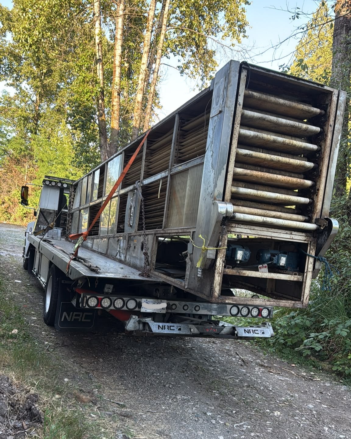 Heavy equipment loaded for removal