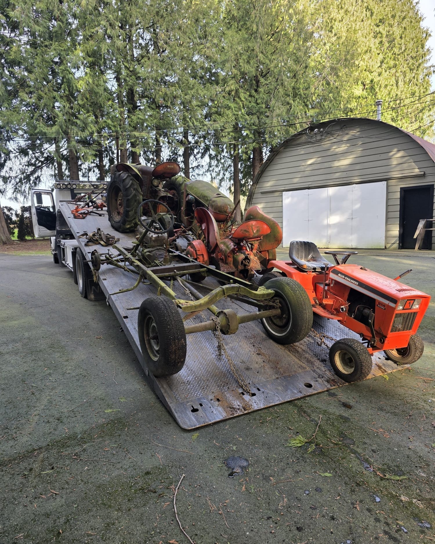 Non-running tractor being removed